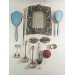 A collection of silver plated items and a large polished pewter photo frame decorated with cherubs -