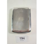 A silver cigarette case engraved regimental badge