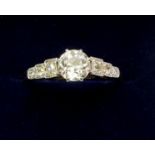 An early 20th century 18 carat gold and platinum ring set central diamond (approx .75 ct) on diamond