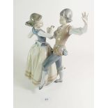 A Lladro porcelain figure, 'Dancing the Polka' model 5252. 28cm high.