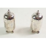 A pair of small silver pepper pots, London 189, 82g