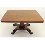 A Victorian mahogany tilt top rectangular breakfast table on tapered column and quadruple scroll