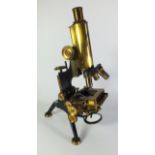 An early 20thC lab microscope with associated lenses, possibly by Watson and Sons. 36.5cm tall