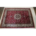 A red ground Kashmir style rug with Sharbas medallion design, 232cm x 158 cm