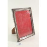 An Italian 800 standard silver photograph frame with stiff leaf border, 21 x 16cm overall