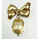An 18 ct gold Longines nurses watch with bow brooch