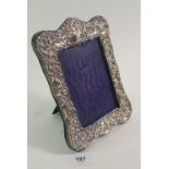 A silver embossed picture frame, Chester 1908, 20 x 15cm