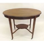 An Edwardian mahogany oval occasional table with crossbanding and undertier