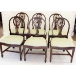 A set of six Hepplewhite style dining chairs with carved decoration