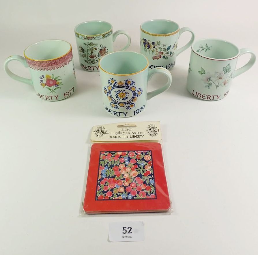 A set of five Liberty and Co. mugs by Adams with coasters.