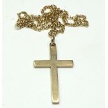 A 9 ct gold crucifix, 5 gm and a 9 ct gold chain, 3.5 gm