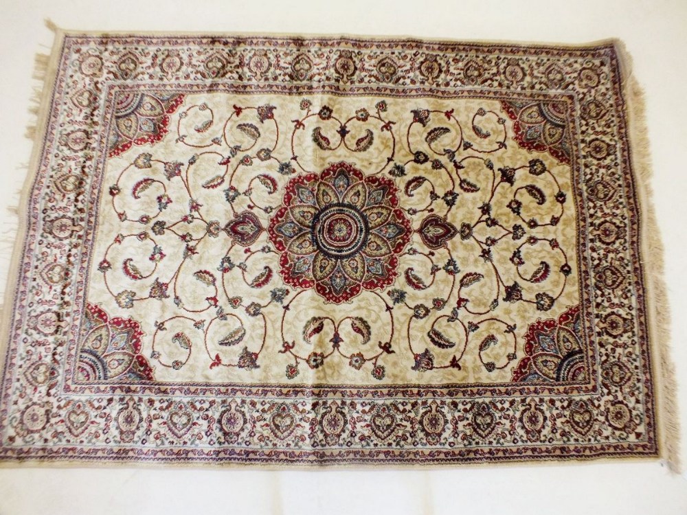 A gold ground Kashmir style rug with floral medallion design 171 x 160cm