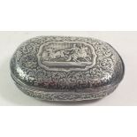 A 19th century Russian soft metal oval large snuff box with all over scrollwork decoration and