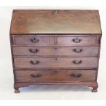A Georgian mahogany bureau with slope front enclosing fitted interior, all over two short and