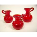 Three miniature dolls house red glass vases