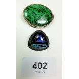 A green stone set brooch and a butterfly wing silver brooch