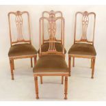 A set of four Edwardian satinwood dining chairs with marquetry interlaced splat back