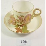 A Royal Worcester coffee cup and saucer painted flowers on a cream ground 'Made for Wright Ray & Co,