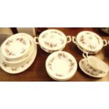 A Royal Albert Lavender Rose dinner service comprising meat plate, six dinner plates, gravy boat,