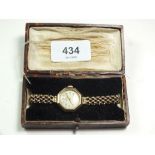 A Record 9 ct gold ladies octagonal wrist watch on 9 ct strap, boxed