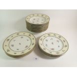 A set of eight Limoges floral plates and eight matching soup bowls
