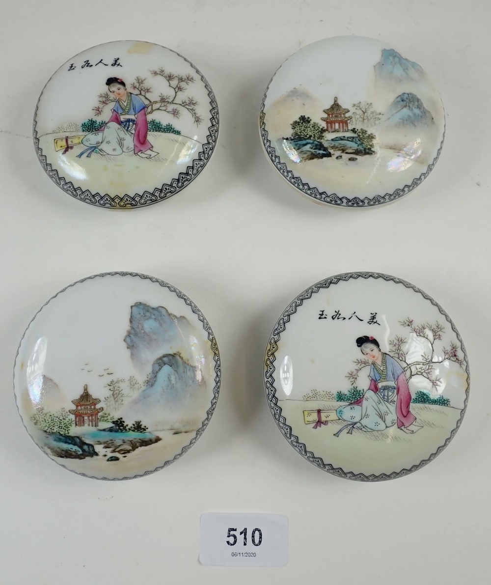 A set of four Chinese circular trinket pots decorated figures and garden scenes, 8.5cm diameter