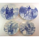 Two pairs of Delft style wall plaques, largest 39cm diameter