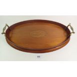 An Edwardian small oval oak galleried tray with brass handles 42.5cm x 25.5cm