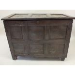 A late 17th or early 18th century deep oak coffer with panelled decoration 120cm x 90cm x 55.5cm