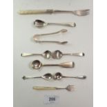 A group of silver cruet spoons, pickle fork, tongs etc, 70gm