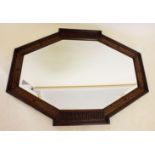 A 1920's oak framed mirror with beaded decoration, 86 x 64 cm