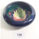 A Moorcroft pin dish, painted berries and leaf, 11.5cm