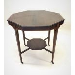 An Edwardian octagonal centre table on turned supports and undertier