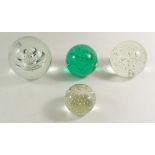 Four bubble paperweights - largest 11cm dia.