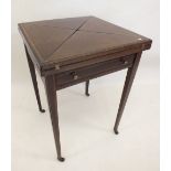 An Edwardian envelope card table with baize interior and counter dishes, 51 x 51 x 78cm .