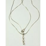 A silver necklace set with triple diamond drop - boxed