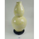 A Chinese 20th century yellow double gourd vase with prunus blossom decoration in white, 31cm
