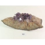 A large amethyst crystal, 27cm long