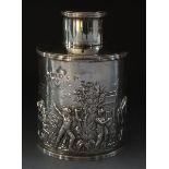 A Victorian silver cylindrical tea caddy with embossed decoration of Bacchanalian scene by Thomas