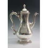 A Georgian silver baluster coffee pot with domed lid, engraved crest, London 1764, 835g