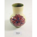 A Moorcroft vase painted hibiscus on a yellow ground, paper label to base, 106 cm