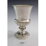A silver Georgian half reeded goblet with beaded steam and leaf border to pedestal base, London