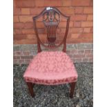 An early 20th century mahogany Hepplewhite shield back chair