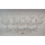 A set of nine early 20th century port glasses with cut stems and panel cut bowls