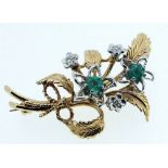 A 9 ct gold leaf form brooch set two emeralds and three diamonds, 1976, 7.6 gm