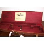 Brady green canvas and leather gun case with red baize lined interior for 28½ ins barrels