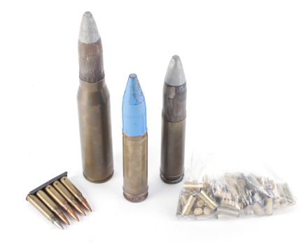 30mm AFV brass shell round, together with two other shell rounds, .38spl brass cases, and 7.62mm