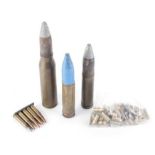 30mm AFV brass shell round, together with two other shell rounds, .38spl brass cases, and 7.62mm
