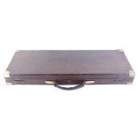 Oak and leather double gun case with brass corners, red baize lined fitted interior for up to 30 ins