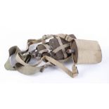 Three military water canteens in webbing carry pouches